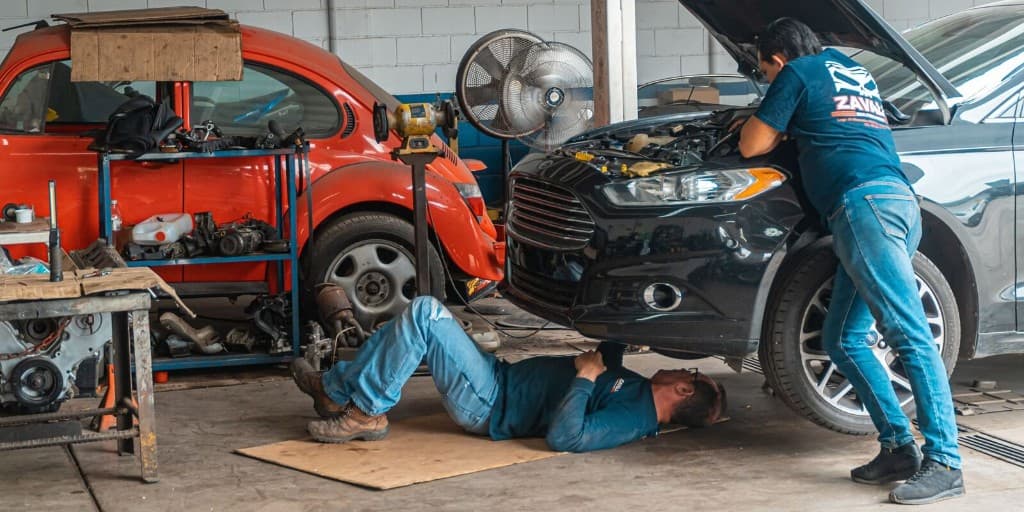 Workshop team repairing cars, SUVs, and light commercial vehicles